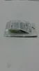 A product in its original packaging on a light gray surface. Voir les images du produit