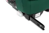 A close-up view of the base of a green car seat, showing the Isofix attachment mechanism. Produktbild-Vorschau