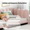 Close-up of a pink upholstered bed with pillows and descriptive text overlays highlighting material and comfort features. Podgląd zdjęcia produktu