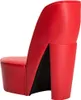 A red high-heeled shoe-shaped chair against a white background. Voir les images du produit