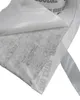 A close-up of a roll of tape with a white backing being peeled back. Produktbild-Vorschau