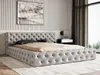 A bedroom setting with a tufted bed. Náhľad obrázku produktu