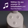 Close-up of the top controls of a baby monitor, with a marketing overlay. Produktbild-Vorschau