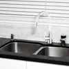 A kitchen sink with a white faucet and a marble backsplash. Produktbild-Vorschau
