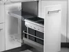 A pull-out kitchen waste bin system with two dark gray bins is shown extended from a white cabinet. Produktbild-Vorschau