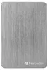 A close-up, top-down view of a silver external hard drive with a brushed metal finish. Podgląd zdjęcia produktu