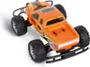 An orange remote-controlled monster truck is shown from a high angle against a white background. Voir les images du produit