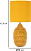 A table lamp with a yellow fabric shade and a textured yellow ceramic base. Anteprima dell’immagine prodotto