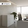 A modern office scene with a filing cabinet, desk, chair, and a large window overlooking a city. Produktbild-Vorschau