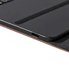 A close-up view of a black keyboard cover with a brown fabric edge, showing a USB-C port. Anteprima dell’immagine prodotto