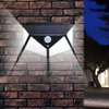 A solar-powered motion-sensing light mounted on a brick wall at night, illuminating the surrounding area. Produktbild-Vorschau