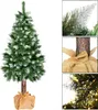 A Christmas tree with artificial snow and a burlap base, shown with close-up details of its branches and trunk. Produktbild-Vorschau