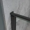 Close-up of a black shower door frame against a gray tiled wall. Produktbild-Vorschau