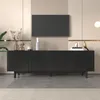 A modern black media console with decorative circles on the doors, placed in a well-lit room with a TV mounted on a slatted wall above it. Decorative items are placed on top of the console. Produktbild-Vorschau