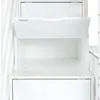A close-up view of a white wooden bunk bed with an open drawer and an open compartment. Anteprima dell’immagine prodotto