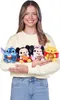 A woman holds four Disney Snackles plush toys in front of her. Produktbild-Vorschau