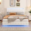 A white upholstered bed with LED lighting in a bedroom setting. Produktbild-Vorschau