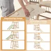 A person's hands are shown adjusting a wooden ramp on a children's indoor climbing frame. The image is divided into sections highlighting different features and configurations of the climbing frame. Produktbild-Vorschau