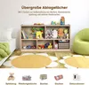 A children's toy storage unit filled with toys and books, placed in a room with a bed and a beanbag chair. There are also decorative rugs on the floor. Podgląd zdjęcia produktu