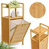 A bamboo bathroom shelf with a laundry basket and towels. Produktbild-Vorschau