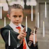 A young person dressed as a wizard holds a wand, surrounded by floating LED candles. Náhľad obrázku produktu