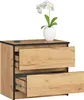 A bedside table with two drawers, a white vase with a white orchid on top, and a remote control. Produktbild-Vorschau
