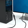 A DVI to HDMI adapter cable connecting a computer to a monitor. Produktbild-Vorschau
