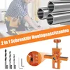 A craftsman is using a circular saw, with a set of metal pipes and a drilling jig shown. Produktbild-Vorschau