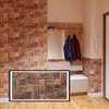 A hallway with a coat rack and a wall covered in wood-look panels. Produktbild-Vorschau