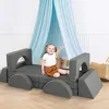 A young child is playing on a modular soft play sofa designed to look like a car, with a blue canopy hanging in the background. Náhled obrázku produktu