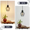 A split image showing a pendant lamp in two different lighting conditions, with a small plant and a book on a table. Produktbild-Vorschau