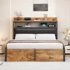 A bed with a headboard featuring shelves and storage, set in a bedroom. Produktbild-Vorschau