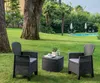 A garden lounge set with two chairs and a table is set up on a green lawn, with a swimming pool and palm trees in the background. Produktbild-Vorschau