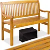A wooden garden bench with a black cover underneath it.