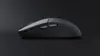 A side view of a black wireless mouse on a black background. Voir les images du produit