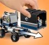 A hand is shown attaching a black cargo container to a gray and blue LEGO truck. Produktbild-Vorschau