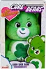 A green plush toy bear in its packaging. Produktbild-Vorschau