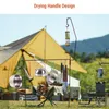 Camping scene with cooking equipment set up. Produktbild-Vorschau