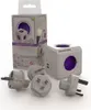 A product shot of a PowerCube DuoUSB ReWirable Travel Plugs with its packaging and accessories. Produktbild-Vorschau