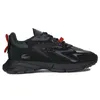 A studio shot of a single black Lacoste sneaker. Anteprima dell’immagine prodotto