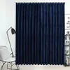 A dark blue velvet curtain hangs in a room, with a chair and a lamp visible to the left, and a shelf with decorative items to the right. Produktbild-Vorschau