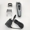 A hair clipper and its accessories are laid out on a white background. Náhled obrázku produktu