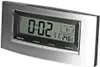 A digital clock with a silver frame is shown against a light gray background. Produktbild-Vorschau