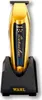 A gold Wahl Detailer cordless hair trimmer is shown standing upright in its black charging base. Náhľad obrázku produktu