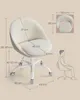 A fluffy beige office chair with dimensions shown and a diagram of a person sitting. Produktbild-Vorschau