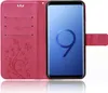 A pink flip case for a Samsung Galaxy S9 Plus phone, open to reveal the phone and card slots. Produktbild-Vorschau