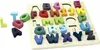 A wooden alphabet puzzle board with colorful letters. Voir les images du produit