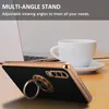 A phone case with a ring stand is shown on a desk next to a laptop and a coffee cup. Produktbild-Vorschau