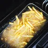 French fries are being deep-fried in a basket inside a deep fryer. Náhľad obrázku produktu
