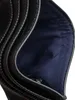 A close-up view of the interior of a black wallet, showing card slots and a blue lining. Produktbild-Vorschau
